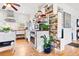 Well-appointed kitchen with stainless steel appliances, white cabinets, and a convenient pull-out pantry at 1439 S Emerson St, Denver, CO 80210