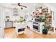 Well-lit kitchen featuring stainless appliances, center island, open pantry, and ample counter space at 1439 S Emerson St, Denver, CO 80210