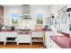 Charming white kitchen featuring stainless hood, farmhouse sink, open storage, and ample counter space at 1439 S Emerson St, Denver, CO 80210