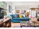 Cozy living room with hardwood floors, comfortable seating, and an open floor plan at 1439 S Emerson St, Denver, CO 80210