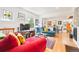 Cozy living room with hardwood floors, bright couches, and an open floor plan at 1439 S Emerson St, Denver, CO 80210