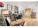 Finished basement office area with hardwood floors, large shelving units with vinyl records, and cool lighting at 1439 S Emerson St, Denver, CO 80210