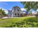 Large backyard with a spacious patio and a deck at 9890 Gaylord St, Thornton, CO 80229