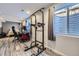 Finished basement featuring a workout station, desk, and bedroom area at 9890 Gaylord St, Thornton, CO 80229