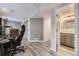 Basement view showcasing modern wood-look floors, closet, and a bathroom at 9890 Gaylord St, Thornton, CO 80229