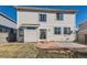 Back exterior of a home with a stone patio, grass, and siding at 4774 Waldenwood Dr, Highlands Ranch, CO 80130