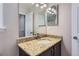 Bathroom featuring a granite countertop vanity and a large mirror at 4774 Waldenwood Dr, Highlands Ranch, CO 80130