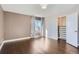 Open bedroom with hardwood floors, a walk-in closet, and natural light at 4774 Waldenwood Dr, Highlands Ranch, CO 80130