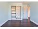 Bright bedroom with built-in closet storage and hardwood floors at 4774 Waldenwood Dr, Highlands Ranch, CO 80130