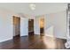 Large bedroom with hardwood floors, walk-in closet, and an en-suite bath at 4774 Waldenwood Dr, Highlands Ranch, CO 80130