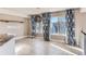Dining area features large windows, pendant lighting, and tile flooring at 4774 Waldenwood Dr, Highlands Ranch, CO 80130