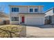 Charming two-story home with a red front door and well-maintained lawn in a residential neighborhood at 4774 Waldenwood Dr, Highlands Ranch, CO 80130