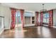 Open living area includes hardwood floors, modern lighting, and backyard access at 4774 Waldenwood Dr, Highlands Ranch, CO 80130