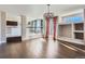 Spacious living area features hardwood floors and large windows for ample natural light at 4774 Waldenwood Dr, Highlands Ranch, CO 80130