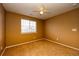 Cozy bedroom with carpet, natural light, ceiling fan, and neutral paint at 7345 S Nucla St, Aurora, CO 80016