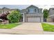 Charming two-story home featuring a two-car garage, well-manicured lawn and appealing curb appeal at 7345 S Nucla St, Aurora, CO 80016