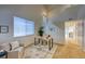 Bright office space with vaulted ceilings, neutral walls, and a modern desk and chair set at 7345 S Nucla St, Aurora, CO 80016