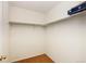 This walk-in closet provides ample storage space with rod and shelving at 7345 S Nucla St, Aurora, CO 80016