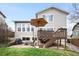 Backyard featuring a patio, deck, and lush lawn, creating an ideal outdoor space for relaxation and activities at 11032 Cannonade Ln, Parker, CO 80138