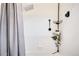 Bathroom features a tub with shower, caddy, and tiled walls at 11032 Cannonade Ln, Parker, CO 80138