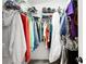 Walk-in closet features hanging racks and shelving at 11032 Cannonade Ln, Parker, CO 80138