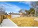 Large backyard space showing grassy lawn and privacy fence; perfect for outdoor activities at 2800 Albion St, Denver, CO 80207