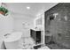 Modern bathroom featuring a standalone tub, glass shower, and double sink vanity at 2800 Albion St, Denver, CO 80207