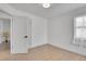 Bedroom boasting wood floors, fresh paint, and new door at 2800 Albion St, Denver, CO 80207