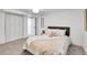 Tastefully decorated basement bedroom with a bed and double closet at 2800 Albion St, Denver, CO 80207