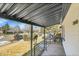 Inviting covered porch with metal railing offering a view of the neighborhood at 2800 Albion St, Denver, CO 80207
