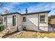 Back exterior of home featuring a well maintained yard at 2800 Albion St, Denver, CO 80207