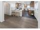 Charming kitchen featuring stainless steel appliances, breakfast bar, tile backsplash, and custom cabinets at 2800 Albion St, Denver, CO 80207