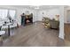 Inviting living room showcasing a fireplace, hardwood floors, and neutral paint, perfect for relaxation and entertaining at 2800 Albion St, Denver, CO 80207