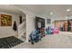 Finished basement area with large TV, play area, and easy access to stairs at 5405 S Sicily St, Aurora, CO 80015