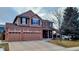 Charming two-story home with a three-car garage and well-manicured lawn at 5405 S Sicily St, Aurora, CO 80015