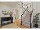 Inviting foyer with a staircase, hardwood floors, and decorative accents at 5405 S Sicily St, Aurora, CO 80015