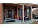 Inviting front porch with brick accents, decorative seating, and a welcoming ambiance at 5405 S Sicily St, Aurora, CO 80015