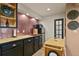 Cozy kitchenette featuring modern appliances, copper sink, and unique backsplash at 5405 S Sicily St, Aurora, CO 80015