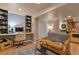 Basement area with built-in desk, comfortable sofa, and stylish decor at 5405 S Sicily St, Aurora, CO 80015