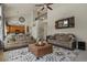 Spacious living room featuring high ceilings, neutral decor, and an open layout at 5405 S Sicily St, Aurora, CO 80015