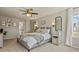 Serene main bedroom with soft lighting, neutral colors, and a view to the outside at 5405 S Sicily St, Aurora, CO 80015