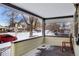 Inviting front porch with two chairs, offering a relaxing view of the street at 141 N 5Th Ave, Brighton, CO 80601