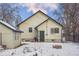 Rear view of the house with access door at 141 N 5Th Ave, Brighton, CO 80601