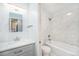 Bathroom features herringbone accent wall, marble shower, and modern vanity at 1610 N Humboldt St # 1/2, Denver, CO 80218