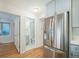 Bright kitchen with stainless steel refrigerator and view to the bathroom at 1610 N Humboldt St # 1/2, Denver, CO 80218