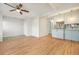 Living room featuring hardwood floors, with an open floor plan and a ceiling fan at 1610 N Humboldt St # 1/2, Denver, CO 80218