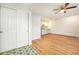 Spacious living room featuring hardwood floors, ample closet space, and a ceiling fan at 1610 N Humboldt St # 1/2, Denver, CO 80218