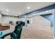 Large basement recreation area featuring carpet and a variety of comfortable seating options at 16650 E Nassau Dr, Aurora, CO 80013