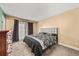 Bedroom featuring neutral carpet, a queen bed, and neutral colored walls at 16650 E Nassau Dr, Aurora, CO 80013