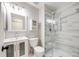 Updated bathroom featuring a glass shower, modern vanity and fixtures at 10329 W Fair Ave # C, Littleton, CO 80127